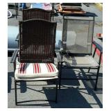 Three folding patio chairs one is non matching