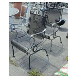 Two wrought iron patio chairs rockers