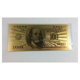 Gold tone note $100