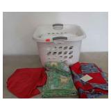 Laundry basket of linens - quilt top, tablecloths,