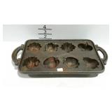 Cast iron mold in the shape of fruits.