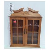 Curio wall cabinet with glass doors and maple