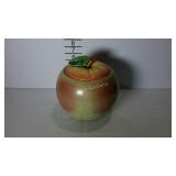 Cookie jar with lid in the shape of an apple.