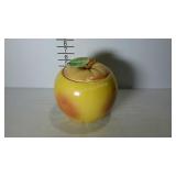 Cookie jar with lid in the shape of an apple.