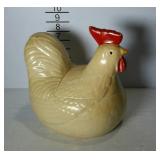 Cookie jar with lid in the shape of a chicken.