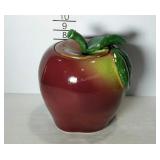 Cookie jar with lid in the shape of an apple.