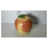 Cookie jar with lid in the shape of an apple.