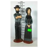 Pair of carved Amish people statues