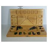 Wooden marble game board with colored stones