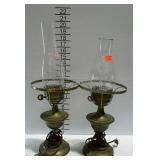 Pair of brass lamps with mismatched glass
