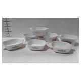 7 corning ware casserole dishes including 2 Marked