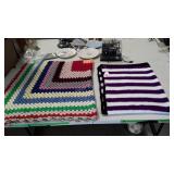 Two crocheted afghans purple white and black