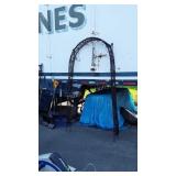 Metal arched Arbor with lights and welcome sign