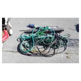 Group of garden hoses, mesh bird block covering