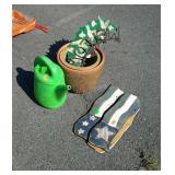 Garden lot with planters, watering can, and decor
