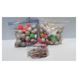 2 Bags of golf balls, and 1 bag of tees and