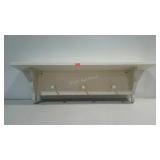 Wall shelf with three coat pegs. 36"×11"×7".
