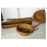 Three wicker baskets. Two with handles, one loaf