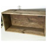 Wooden book crate with dovetailed corners.