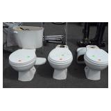 Group of three American standard  commodes, one