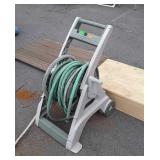 Hose reel with hose, does have some damage