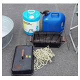 Portable grill, two poly kerosene cans, and rope