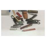 Plastic container with pocket knives, shoe horns,