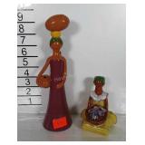 Ceramic figurines, one marked made in Dominican