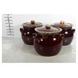 Three Hull Pottery bean pots with lids, chip on