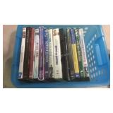 Plastic container with a few DVDs