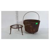 Cast iron tri-footed pot with wire bail handle and