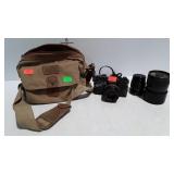 Canon FT b camera with neck strap, owners manual,