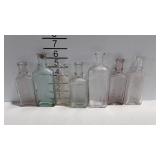7 Embossed medicine bottles - Goff