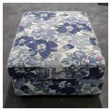 Floral Ottoman has piping trim wear from use as
