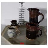 Four Pottery Pitchers, milk and creamer sizes,