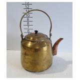 Brass tea kettle with copper spout
