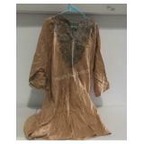 Smock needs cleaning and has a tear