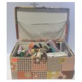 Sewing box with thread, zippers, seam binding,