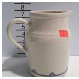 Pottery pitcher with blue accent design, made in