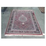 Multi colored area rug with center medallion, is