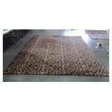 Brown area rug with multi colored dots, is 8 feet
