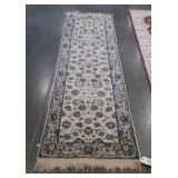White and blue hallway runner with flower design,
