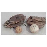 Two older baseball gloves with softball and