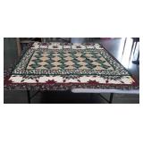 Group of two quilts one is green with star and