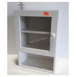 White medicine cabinet with glass door and open