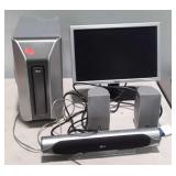 Dell computer screen with LG sound bar, speakers,