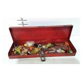 Metal box full of fishing flies and spinners
