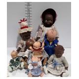 8 Vinyl Kewpie dolls, with 1 doll stand -some with