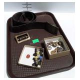 Belt buckles, marbles, and metal buttons