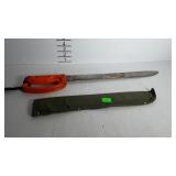 Machete with back edge saw in green nylon sheath,